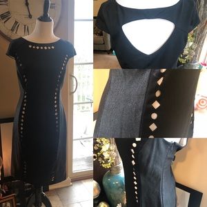 Black fitted sheath dress with lined cutouts